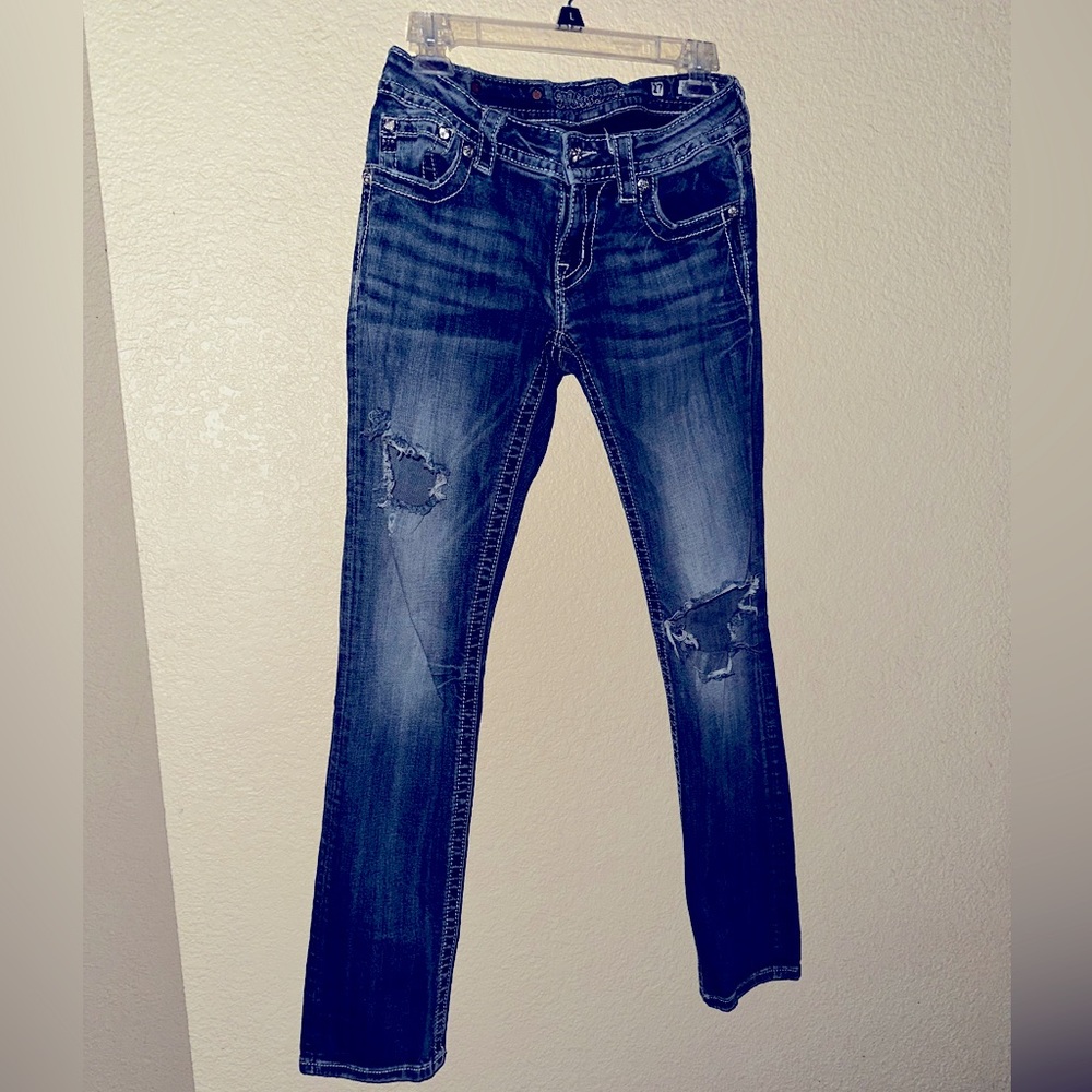 Fashionable blue jeans with rips and bling You cant go wrong with these beauties